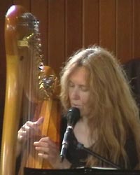 Holy Trinity Robyn Sutherland playing the harp and singing for wedding guests